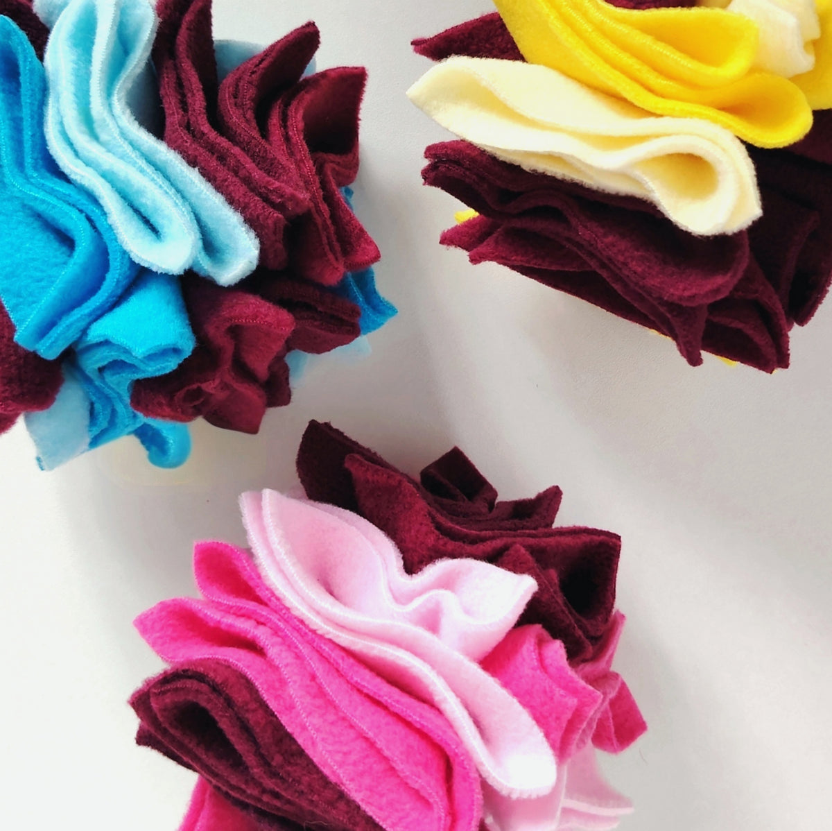 Nova Zeal Scruffle Balls in three colourful fleece designs, handmade for dog enrichment