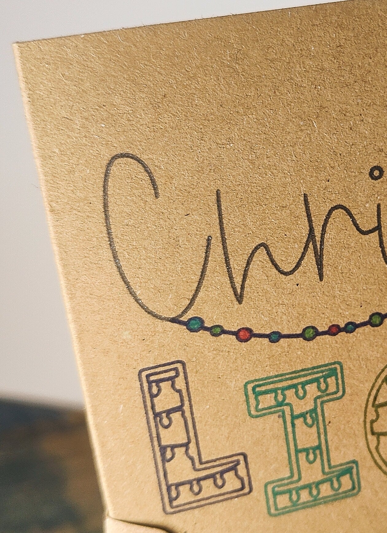 Close-up of a Kraft Card with 'Christmas' and 'LIGHTS' on it.