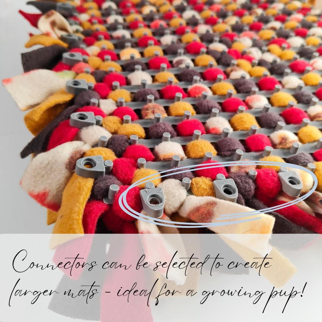 Colourful Autumnal mat showing connectors to create a larger mat on a grey background