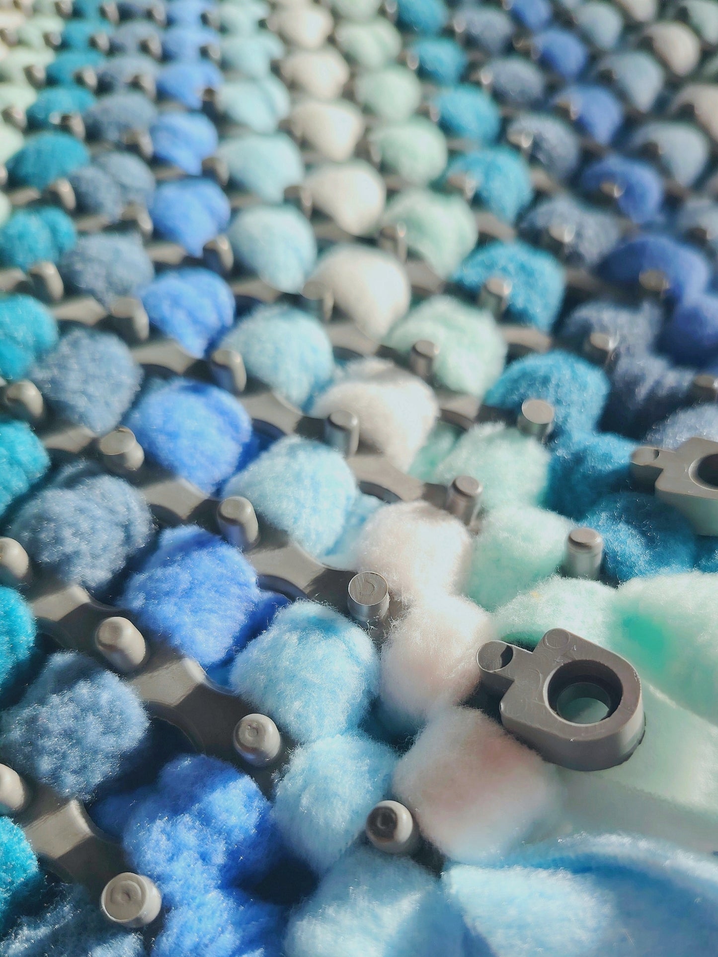 Snuffle mat base showing fleece tied into durable plastic grid.