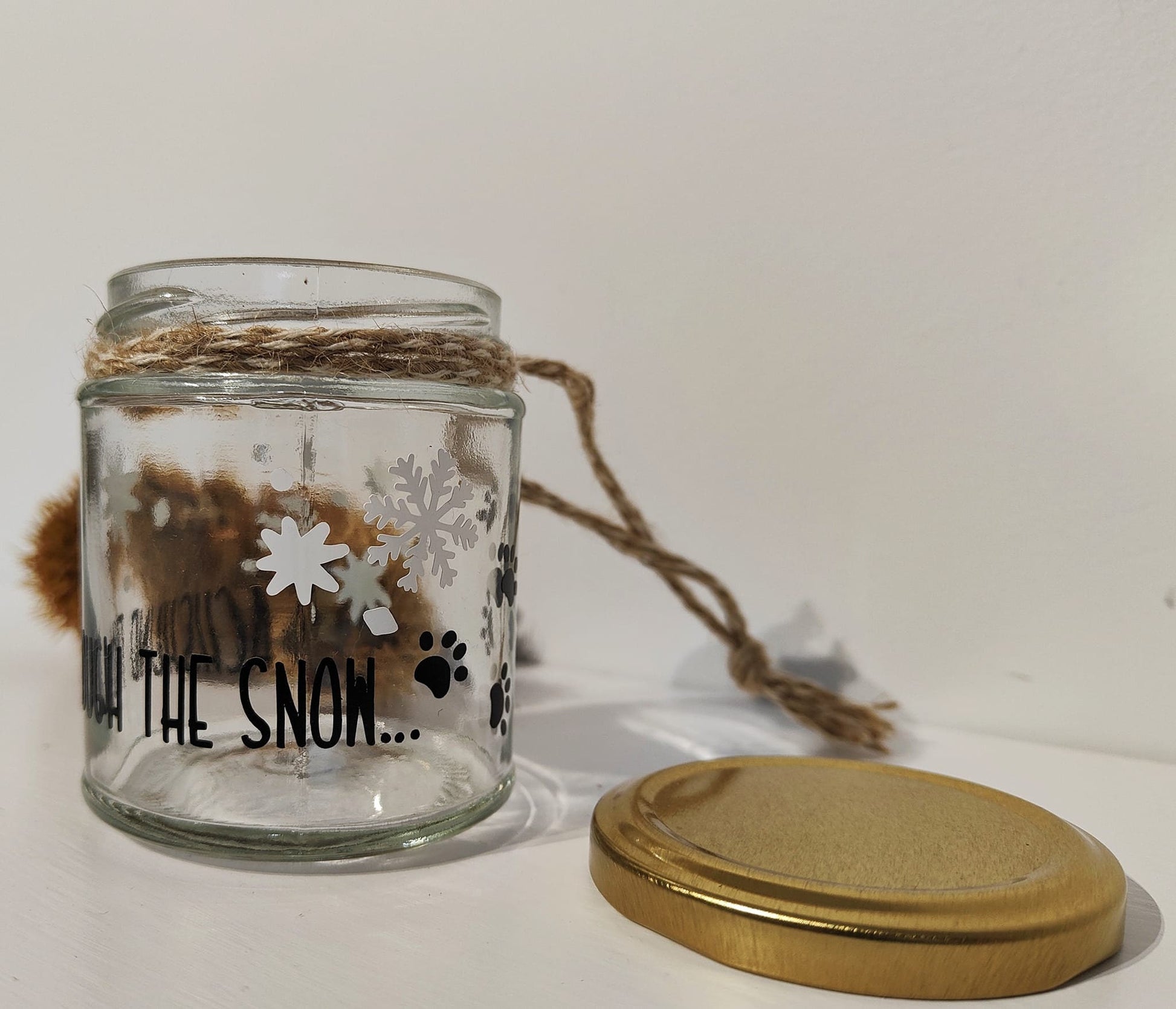 Glass jar with decorative elements on a white background