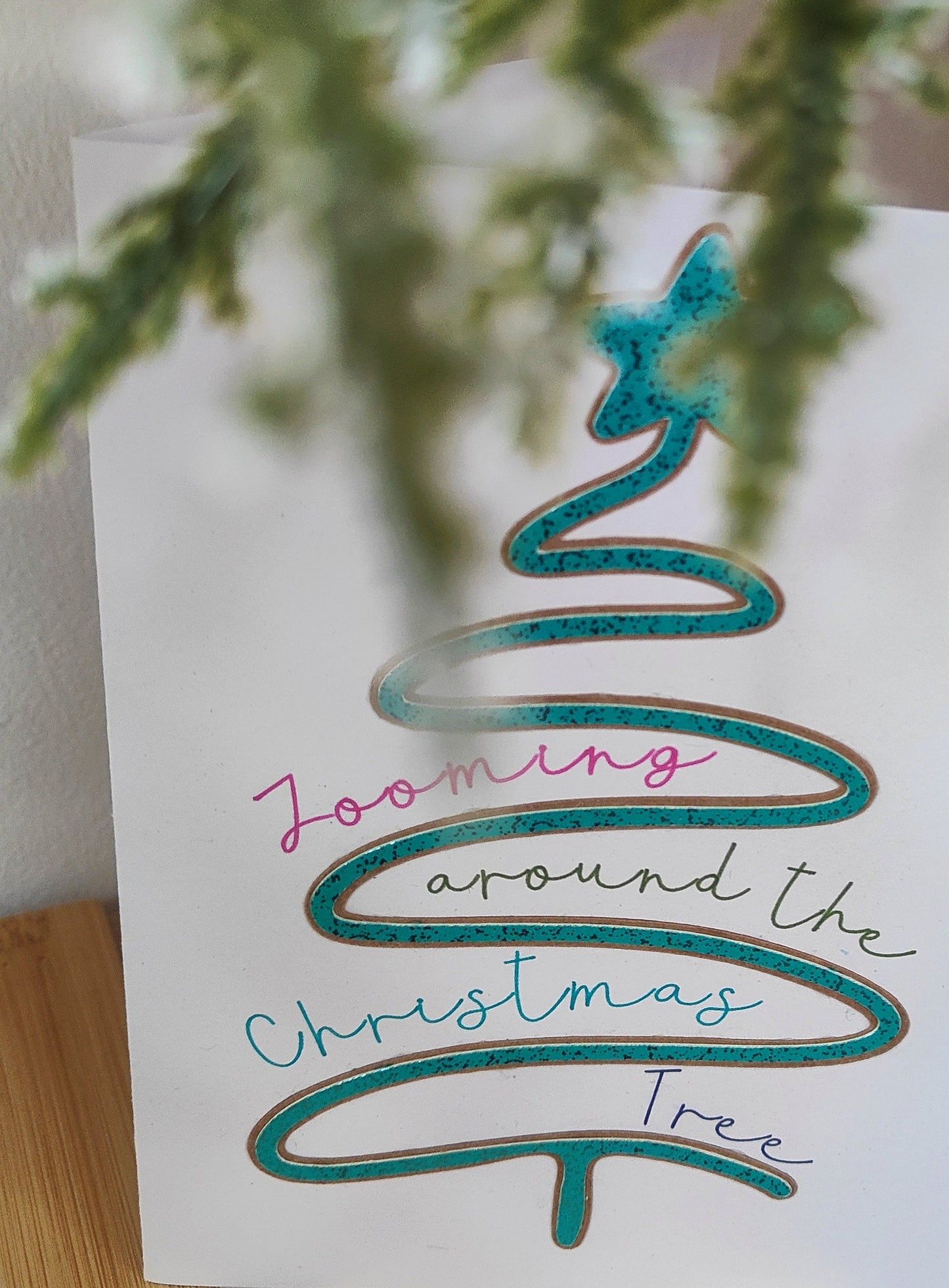 Card with a Christmas tree design and text 'Zooming around the Christmas Tree' on a white background.