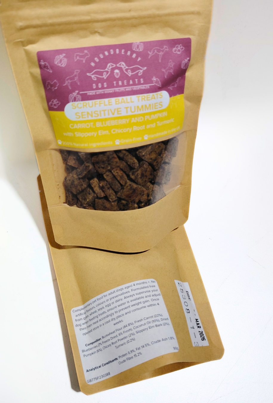 Sensitive Tummies dog treat package with visible treats, a ingredients label and branding on a white background.