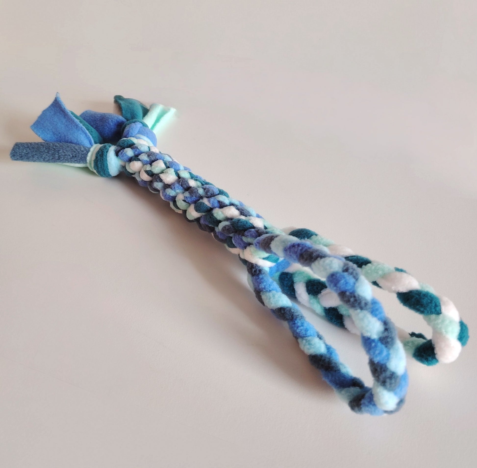 Cool colour fleece dog tug toy by Nova Zeal, handmade enrichment toy for interactive play.