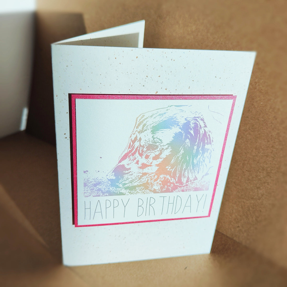 Pink Cocker Spaniel Happy Birthday card standing upright, showing the colourful spaniel design.