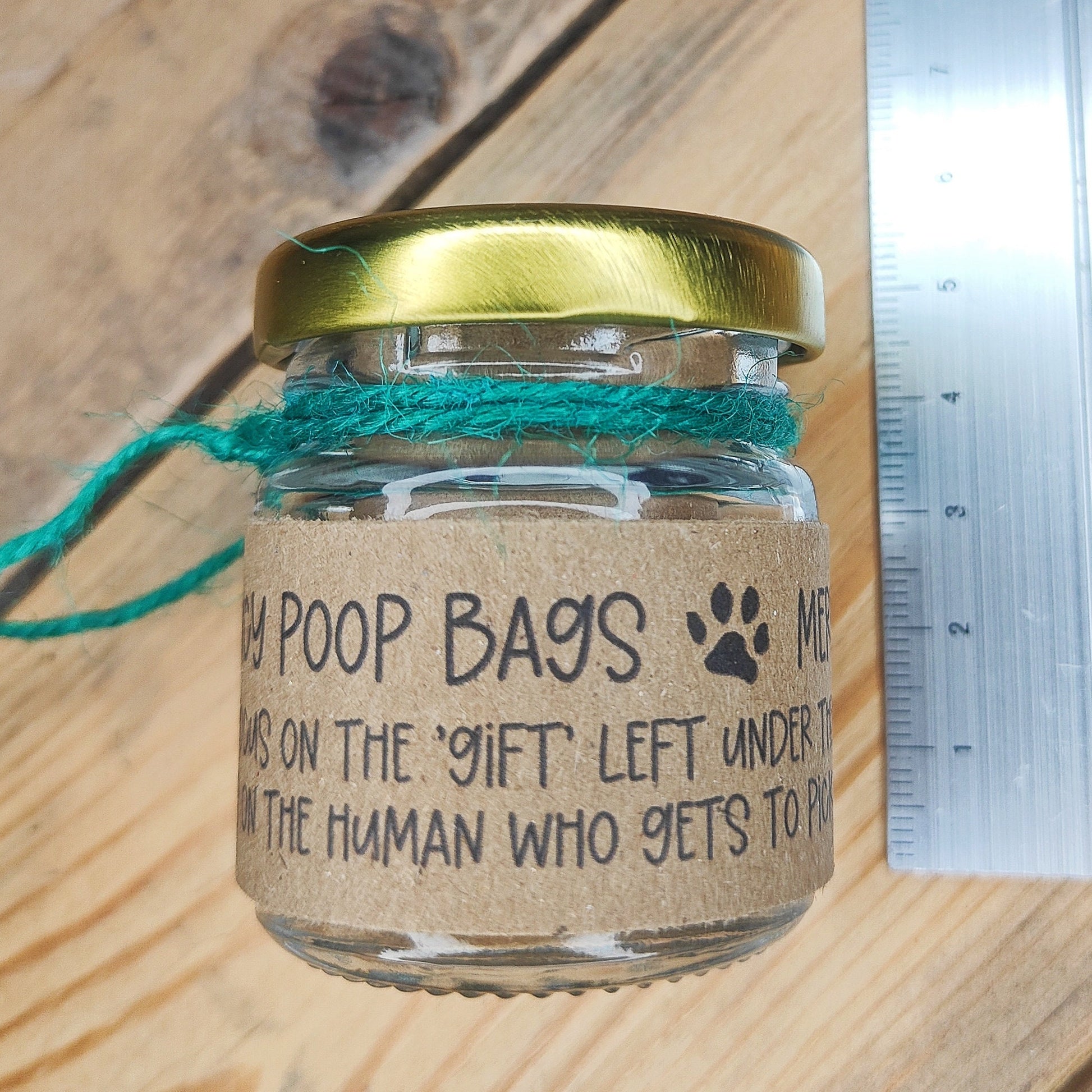 A small jar lying on its side, showing its height (5cm) 