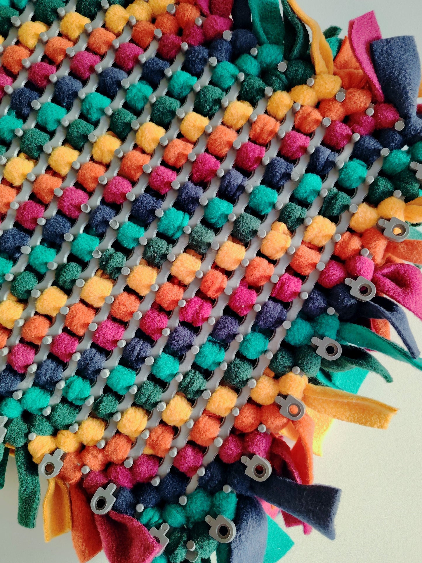 Snuffle mat base showing fleece tied into durable plastic grid.