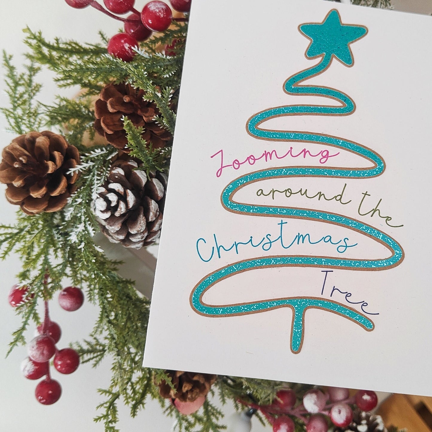 Christmas-themed card with decorative elements and text on a white background