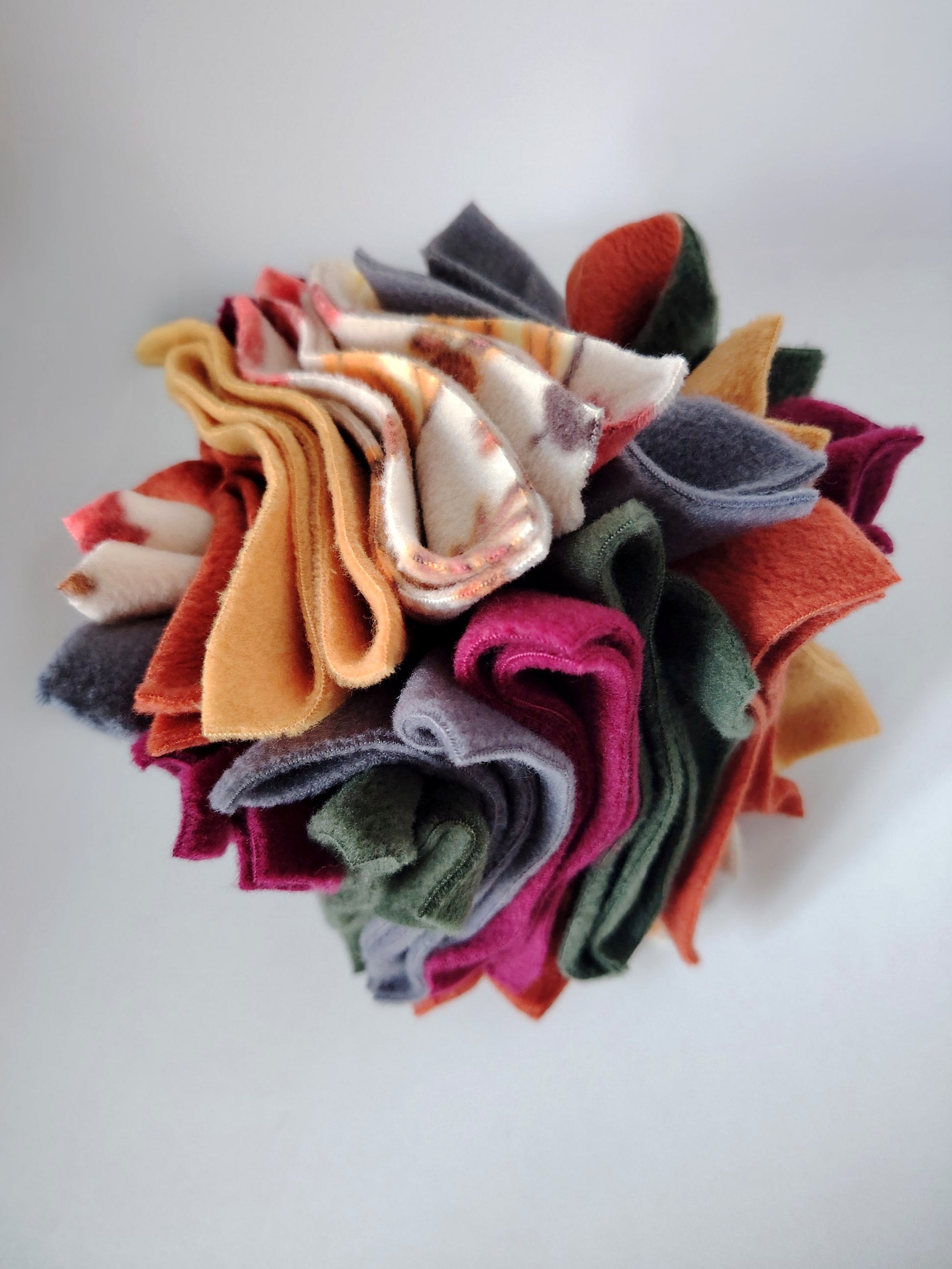 Nova Zeal Autumn Scruffle Ball handmade with layered rust, mustard, plum, green and grey fleece.