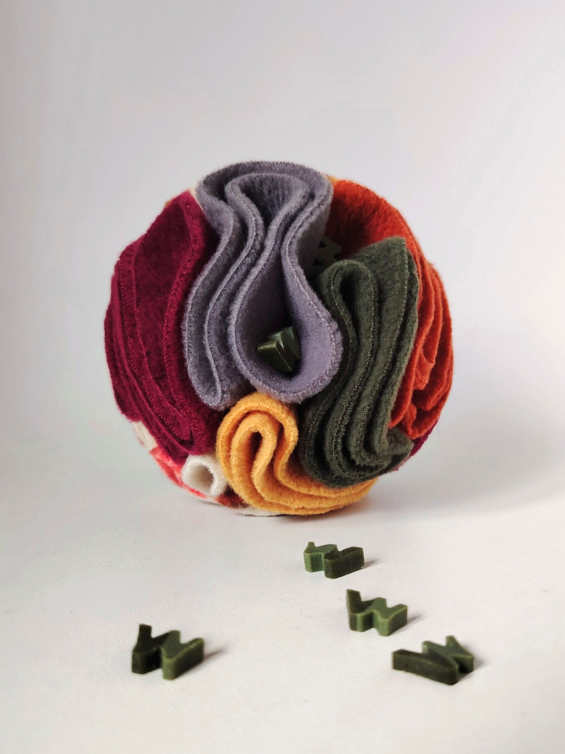 Autumn Snuffle Ball for dogs with W'ZIS treats hidden between the fleece folds.