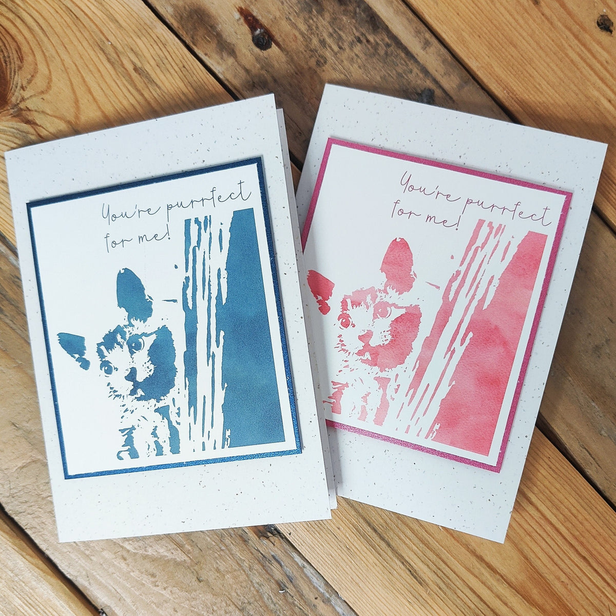 Blue and pink "You're purrfect for me" cat cards with raised Polaroid-style kitten illustration.