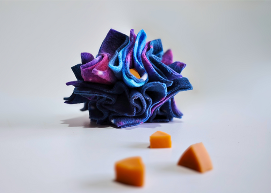 Fleece snuffle ball enrichment toy designed to encourage natural foraging and mental stimulation