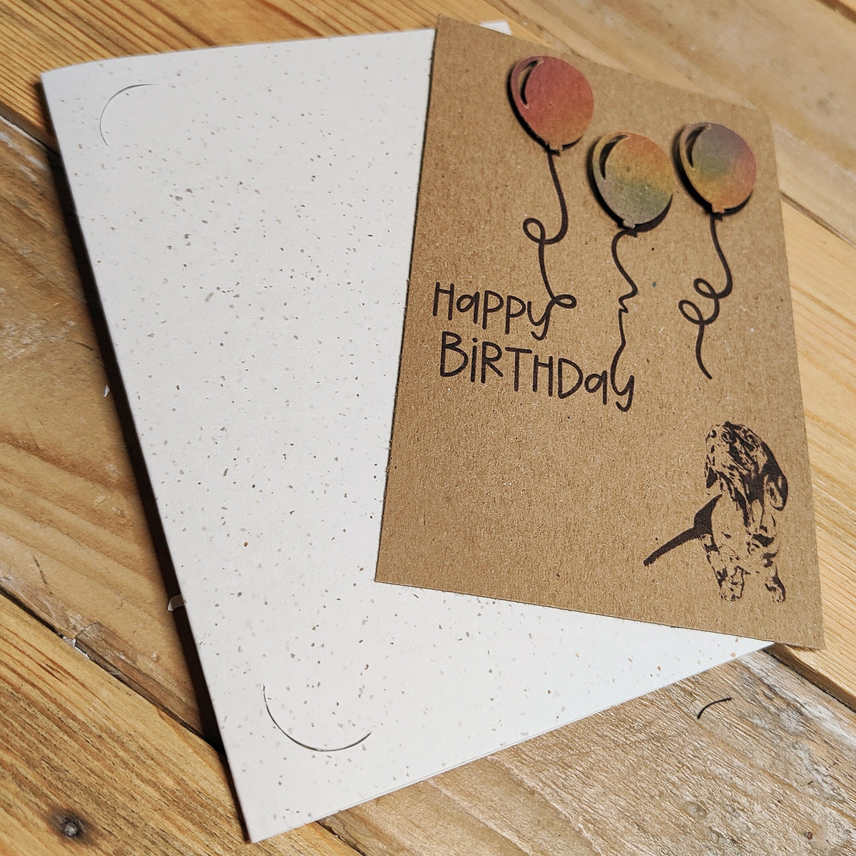 Removable Miniature Dachshund birthday card with colourful balloons shown outside the card.