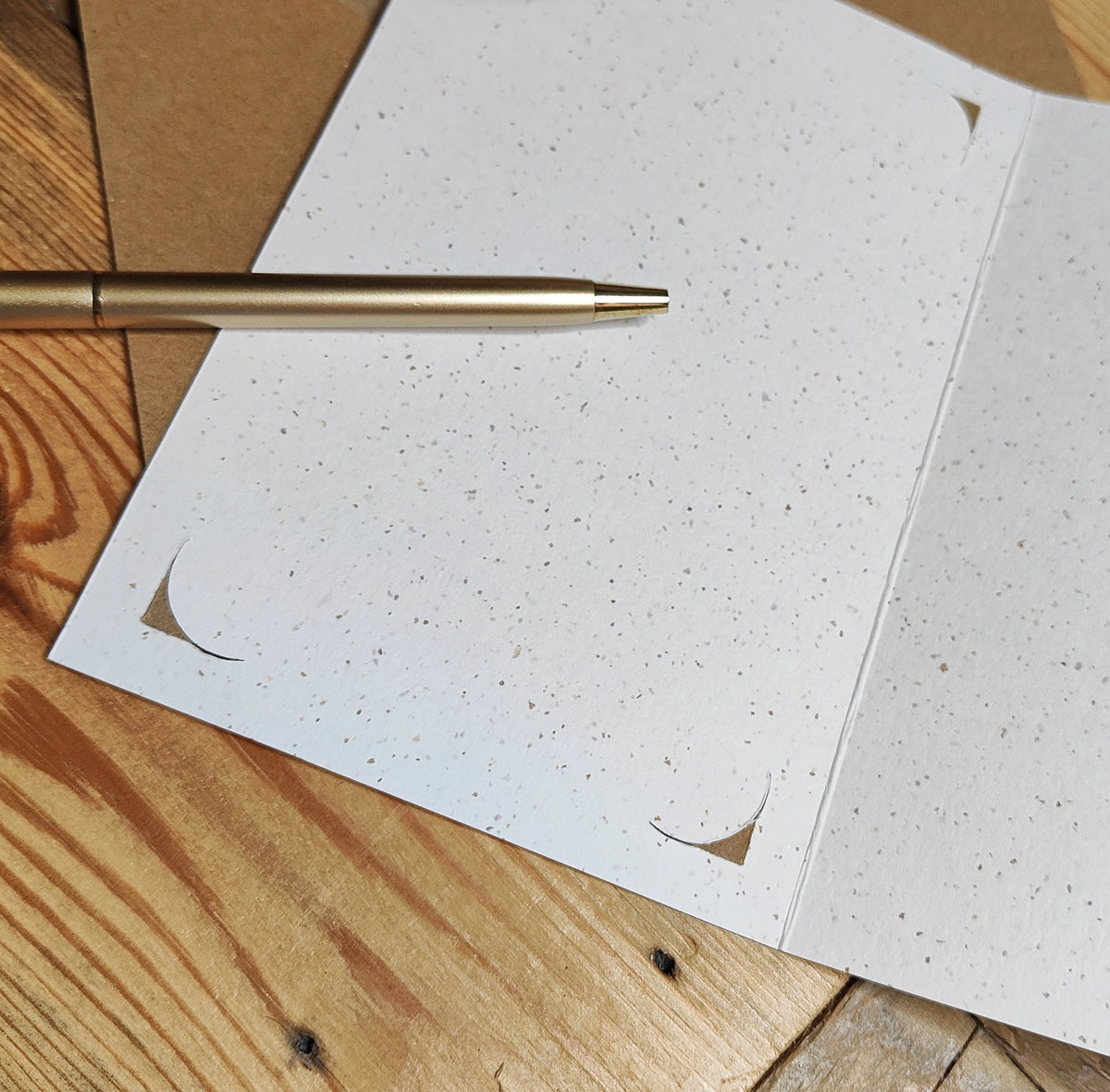 Card base showing the corner slots used to hold the removable Miniature Dachshund birthday keepsake.