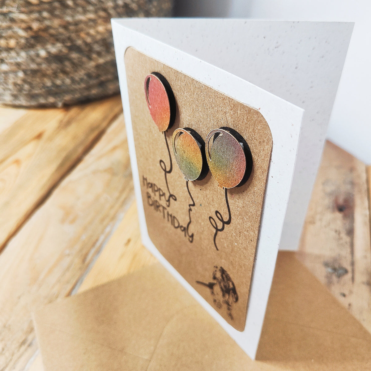 Side view of the Miniature Dachshund birthday card showing the layered raised balloon detail.