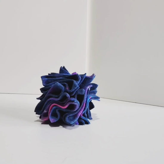 Miniature Dachshund using the small  Christmas Star Enrichment Toy