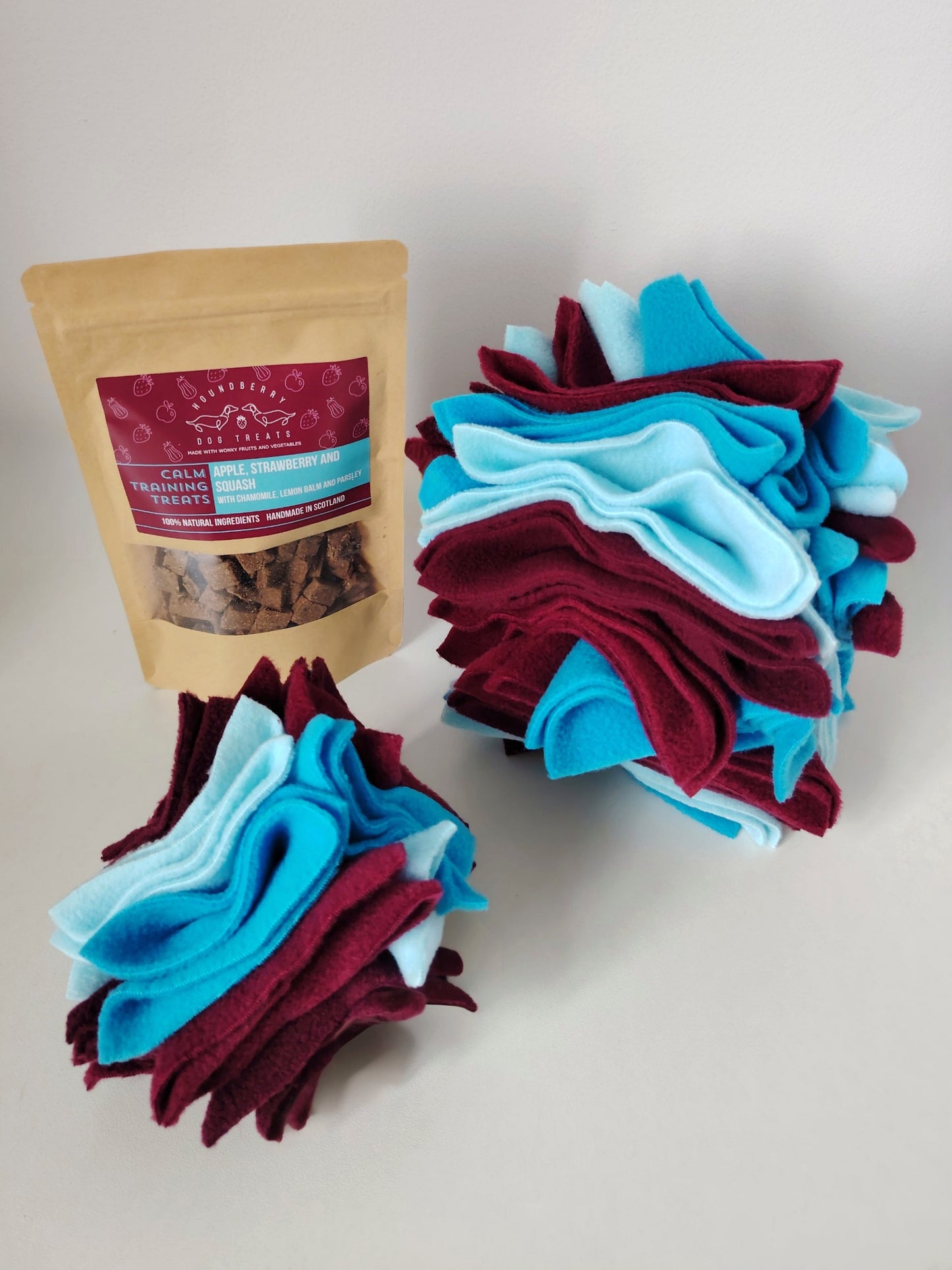 Small and large Scruffle Ball with Houndberry dog treats for scent-based enrichment.