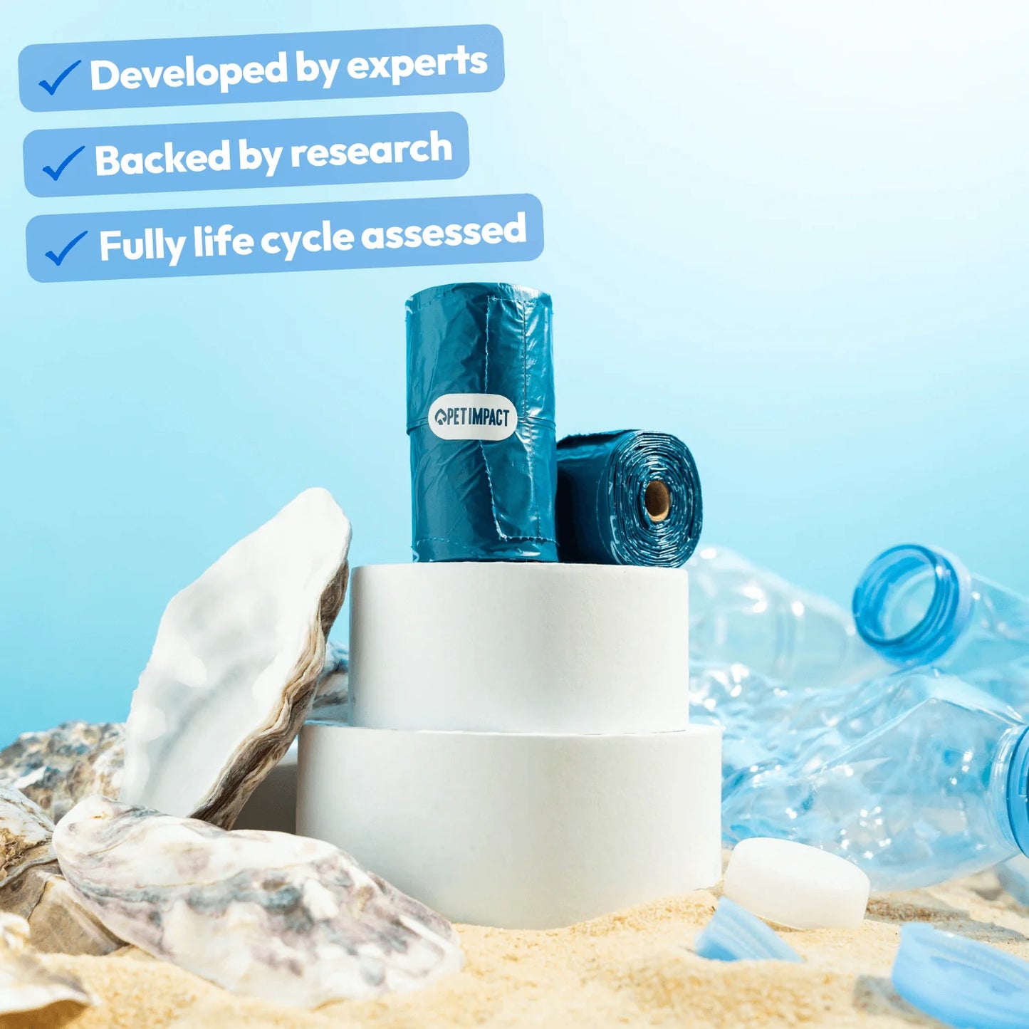 Pet Impact ReSEAcled dog poo bag rolls displayed with plastic and oyster shell materials, highlighting that they were developed by experts, backed by research and fully life cycle assessed.
